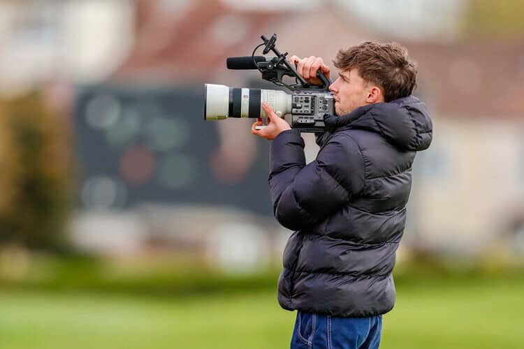 Ruaraidh filming with a long lens pitch-side